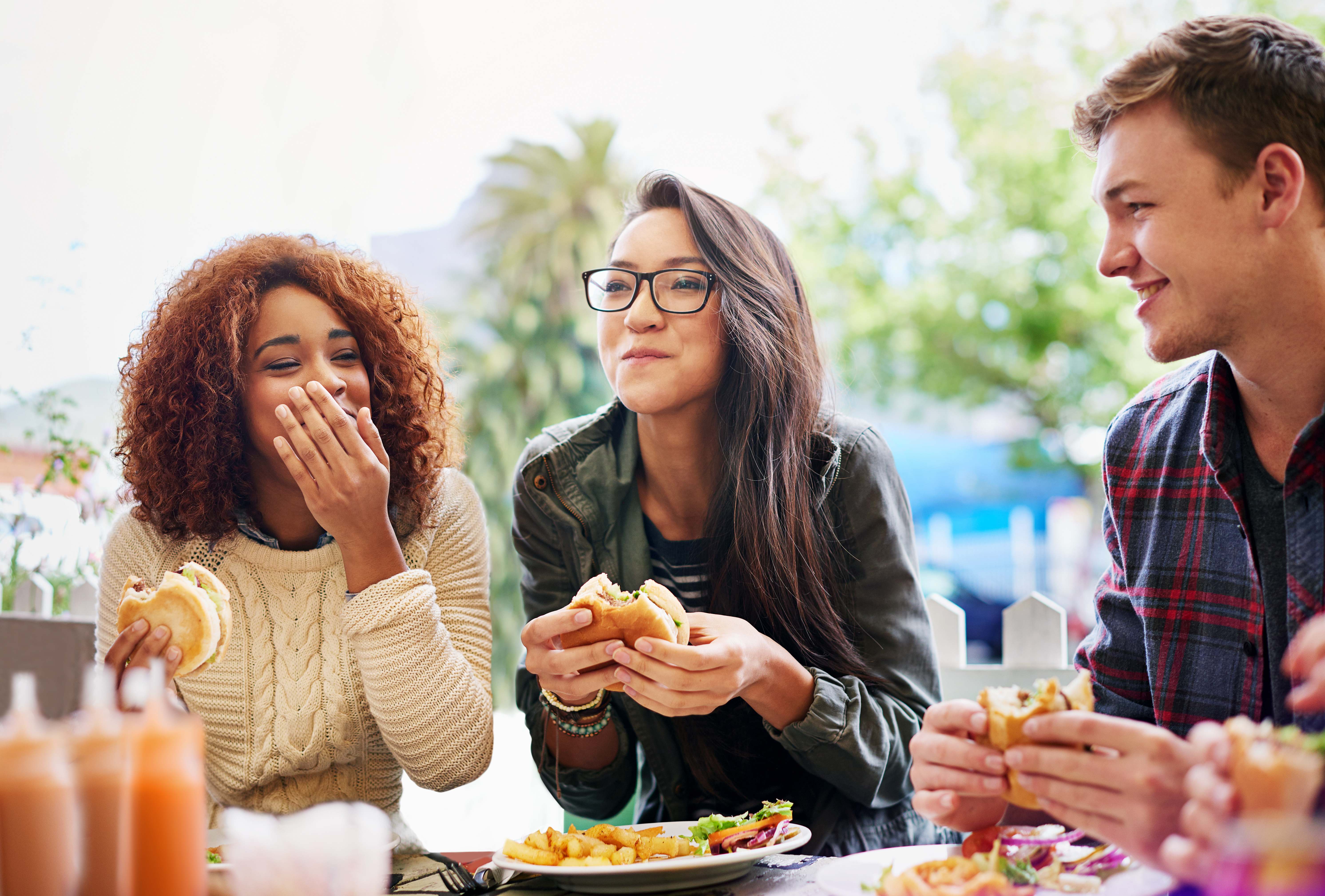 Friends enjoying a meal together at a restaurant
